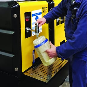 Oil Storage and Organization. Person pours oil into a sample tester for testing oil purity